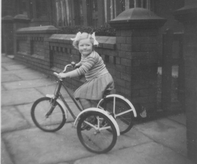 Ann b-1949 on her tricycle.jpeg